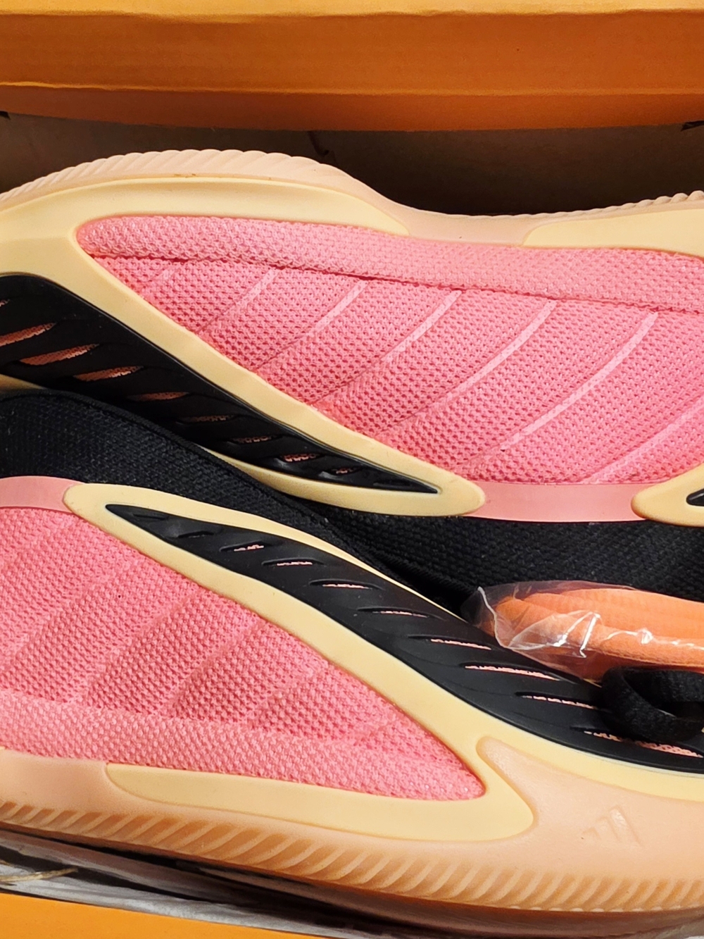 The image shows the adidas Anthony Edwards 2 basketball shoes in the Acid Orange